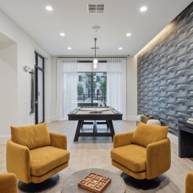 Lounge area with pool table and a tv Lounge area with pool table and a tv