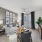 Living area with large windows and hardwood floors